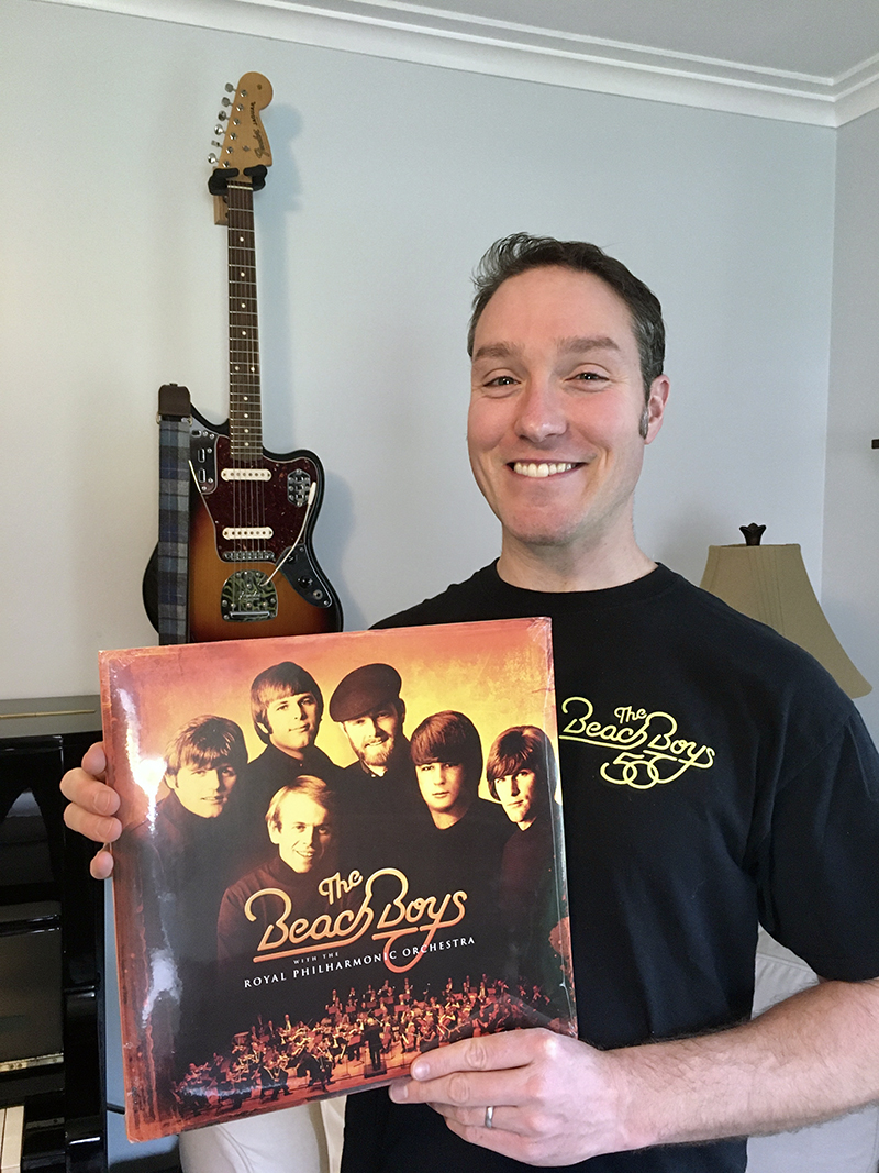 Scott proudly holds the still-sealed orange vinyl two-LP set from ESQ Scott KennedyONLINE